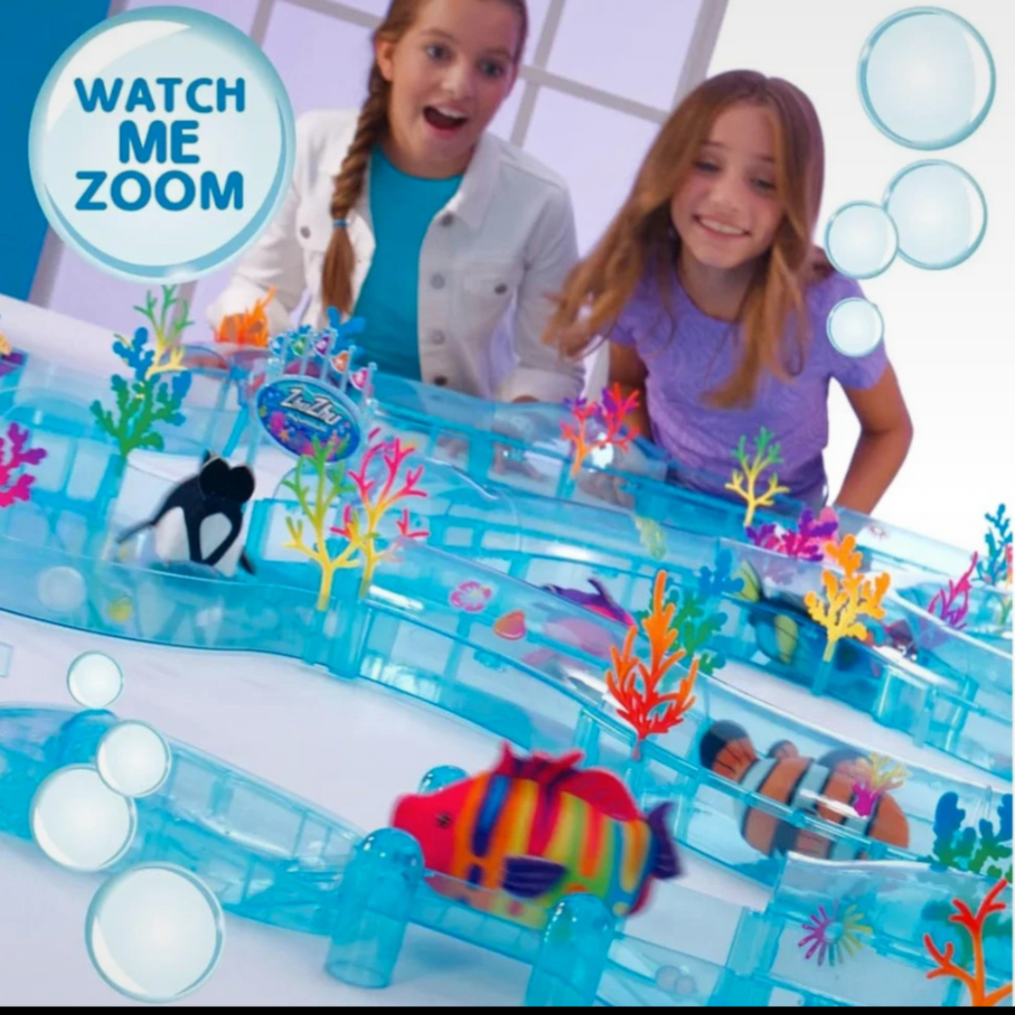 Children playing with an underwater playset on a screen
