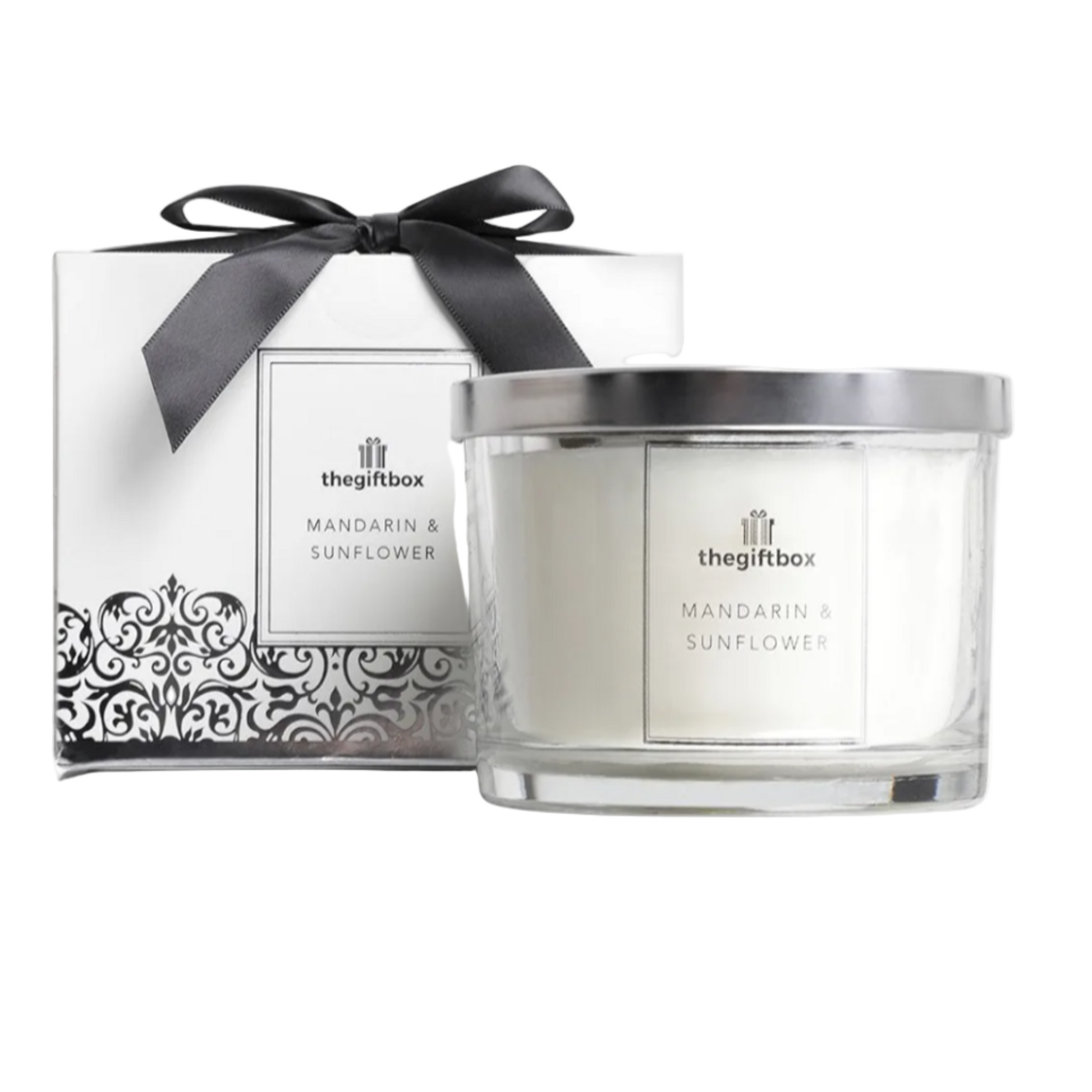 Candle with decorative box featuring 'the gift box' branding on a white background