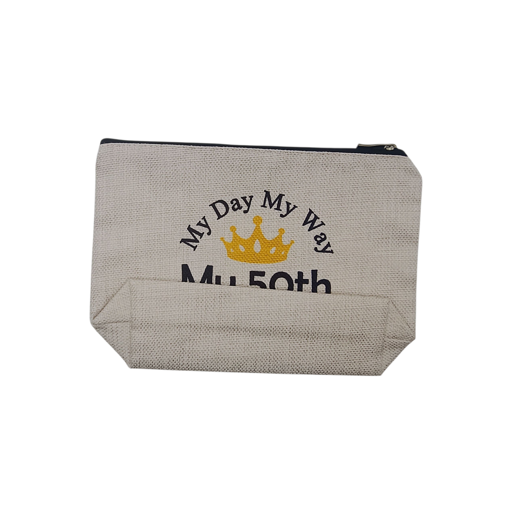 Beige pouch with 'My Day My Way My 50th' text and crown design on a white background