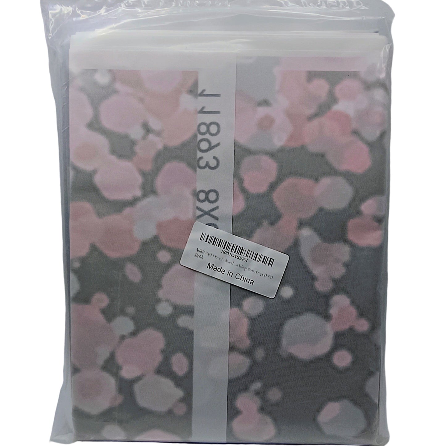 Packaged product with pink floral design on a gray background