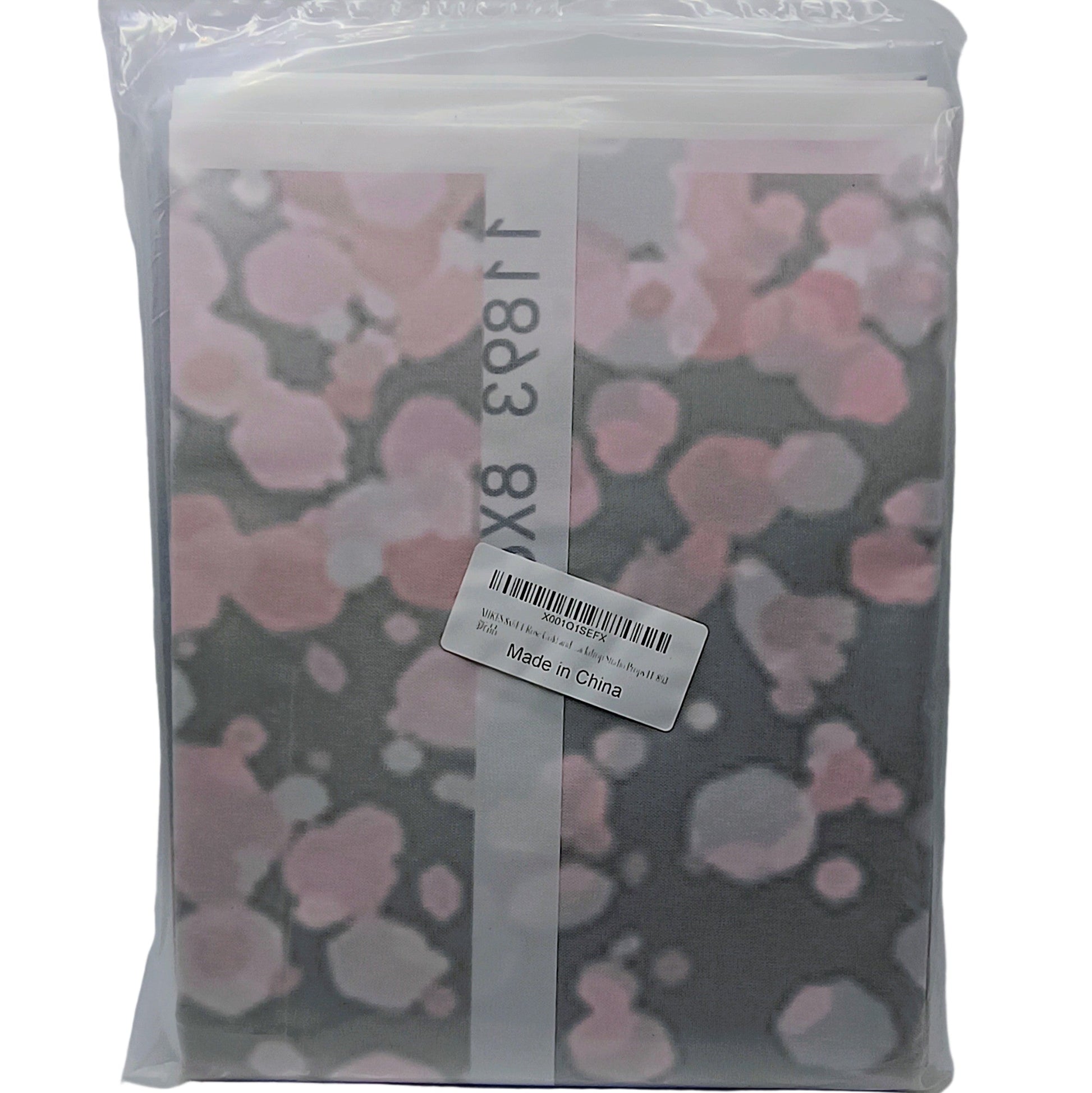 Packaged product with pink floral design on a gray background