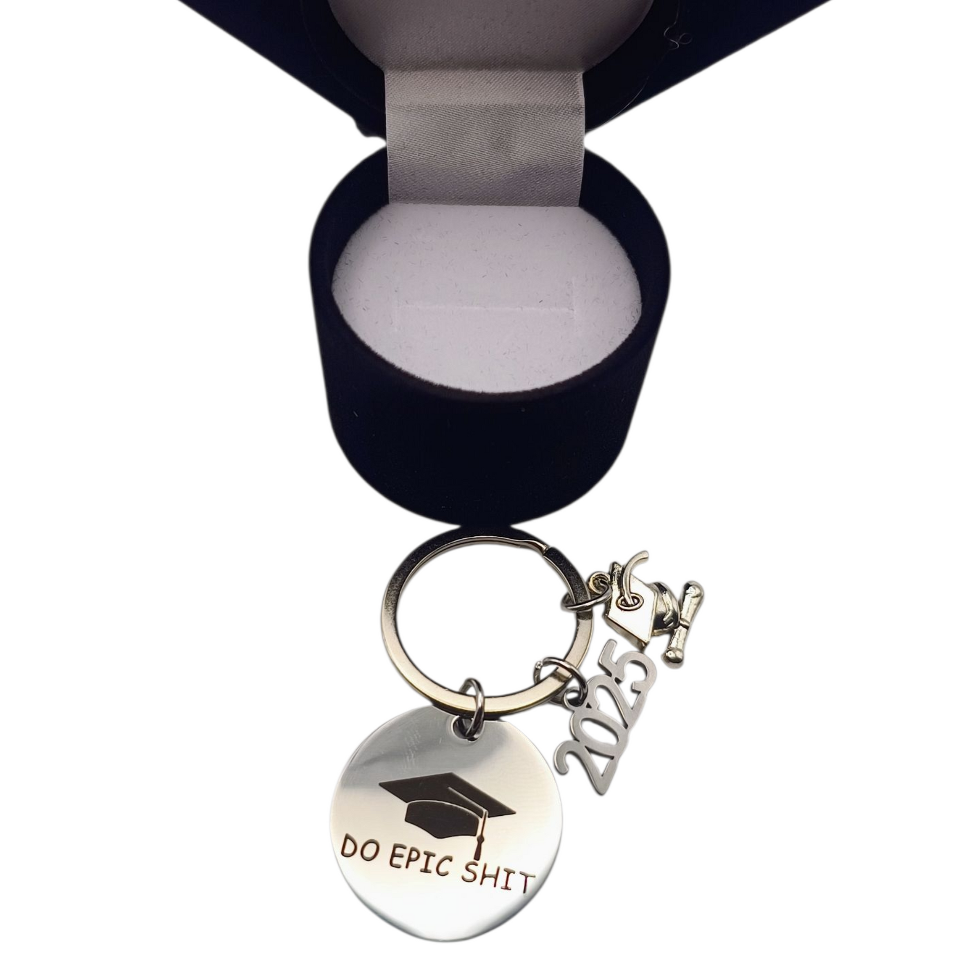 Keychain with 'DO EPIC SHIT' and design in a black velvet box on a white background