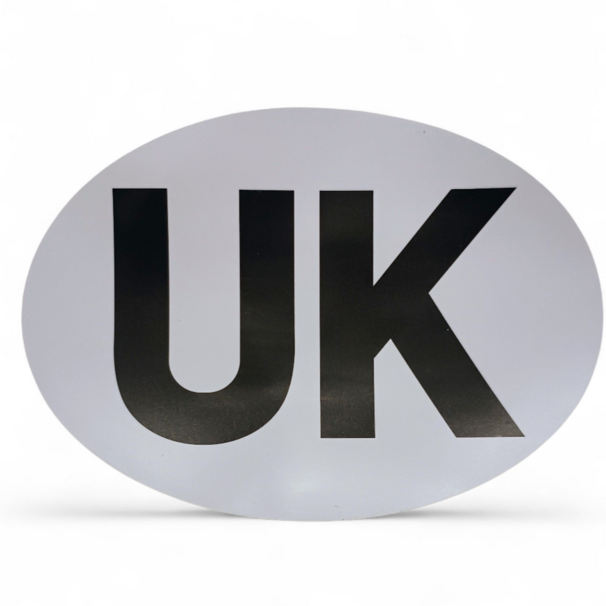 Oval-shaped sign with 'UK' on a white background