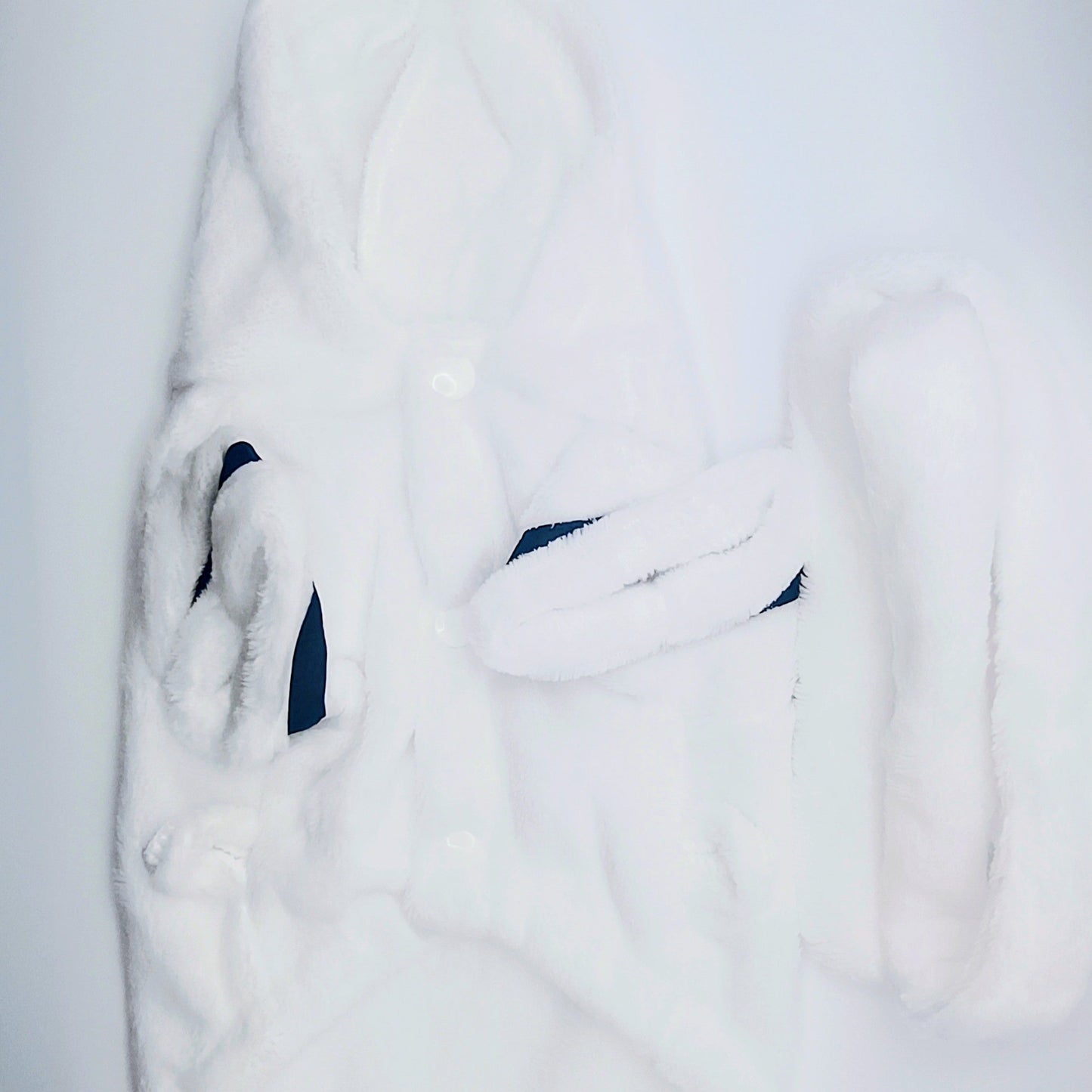 White fur coat with a hood on a white background