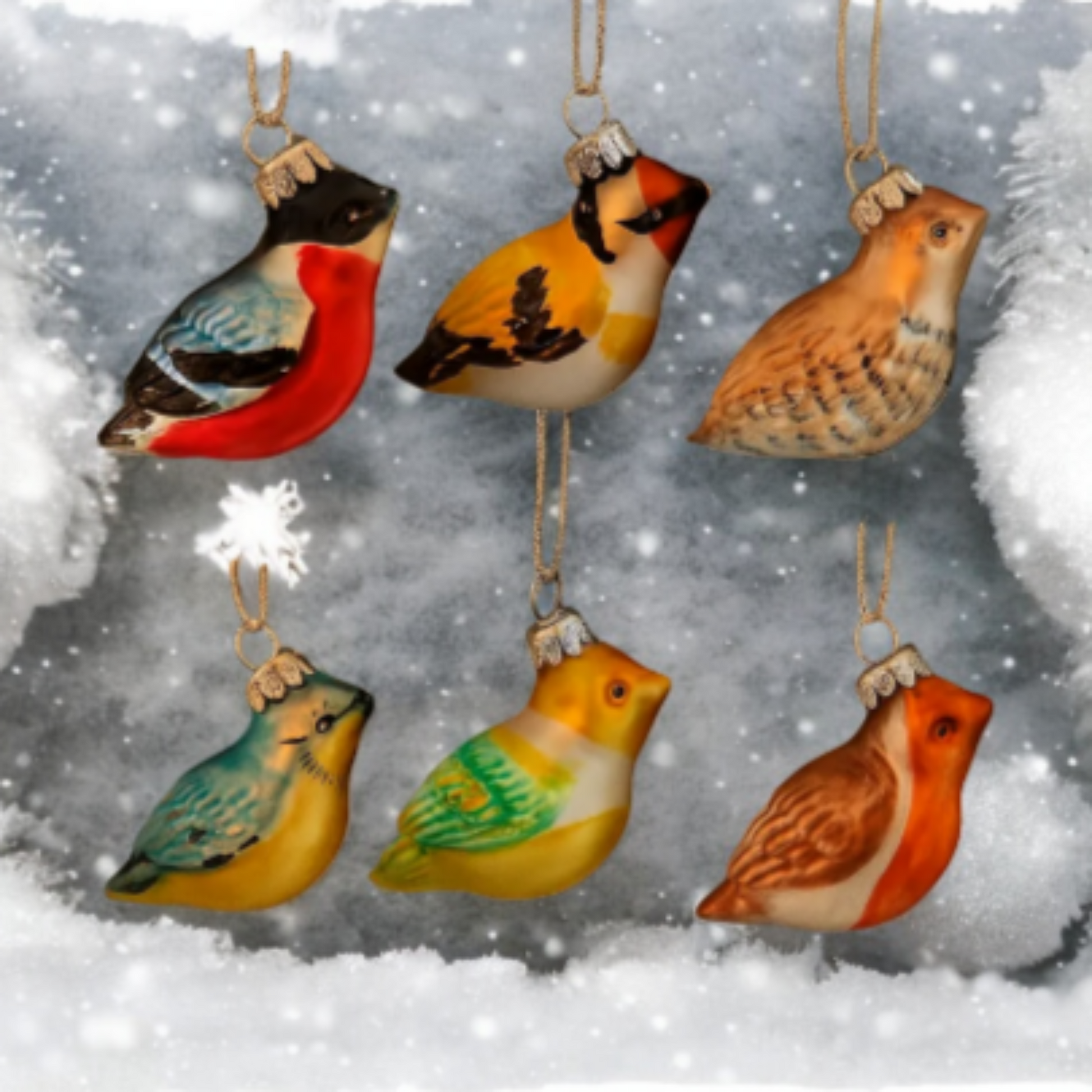 Colorful bird-shaped ornaments hanging against a snowy background