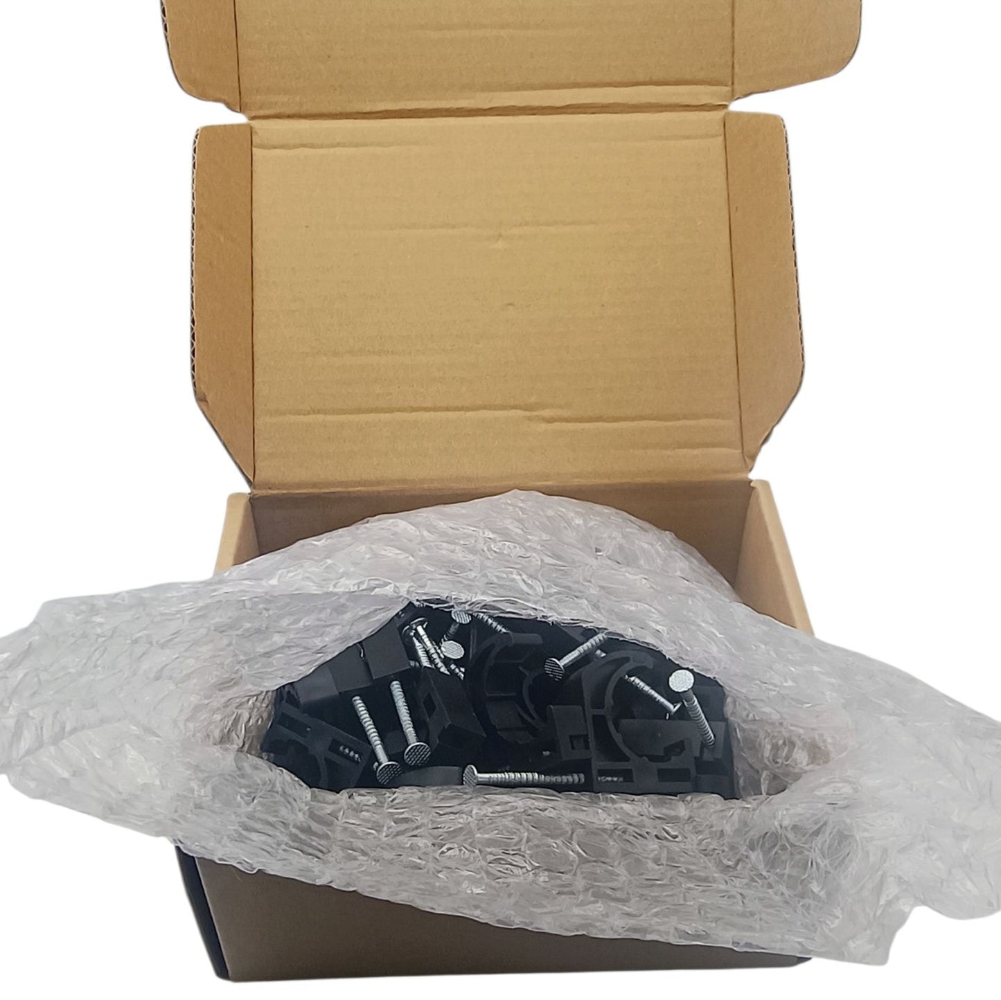 Black metal bracket with screws in a cardboard box with bubble wrap